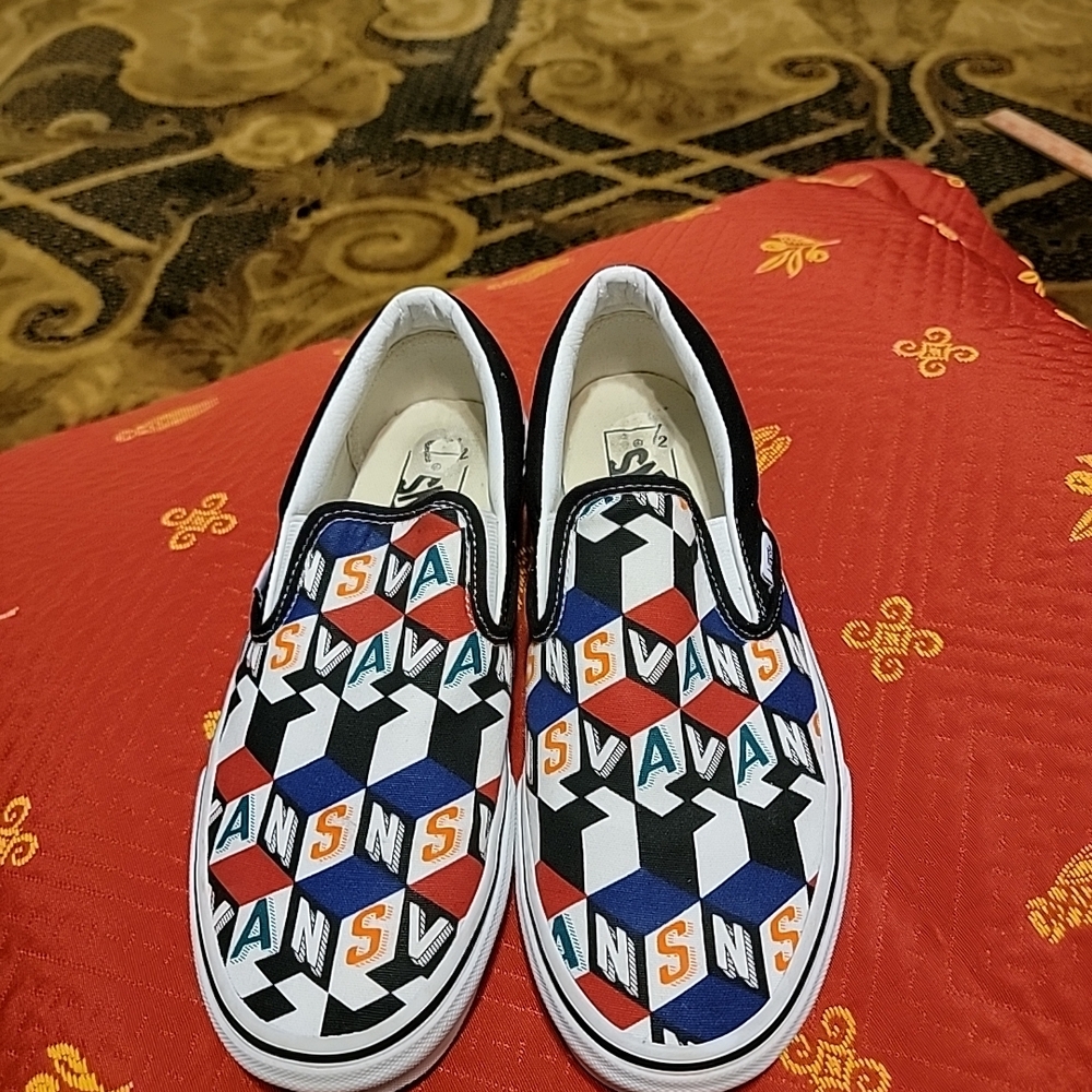 Vans Slip-On Geometric Logo Print in Red, Blue, Black, White